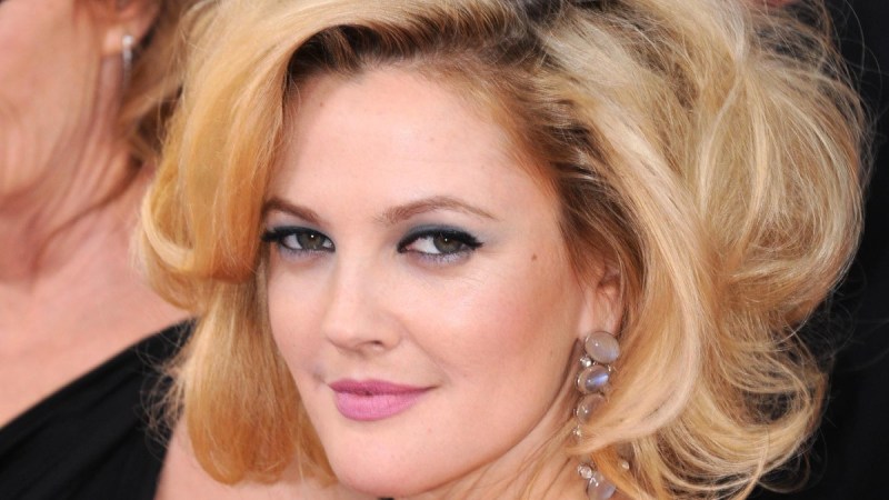 Drew Barrymore shoots a sultry look over her shoulder on the red carpet