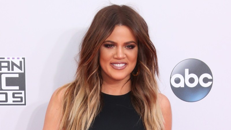Khloe Kardashian wears a black dress on the red carpet