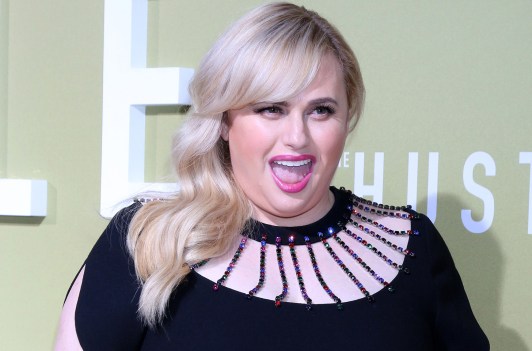 Rebel Wilson with her mouth open, laughing