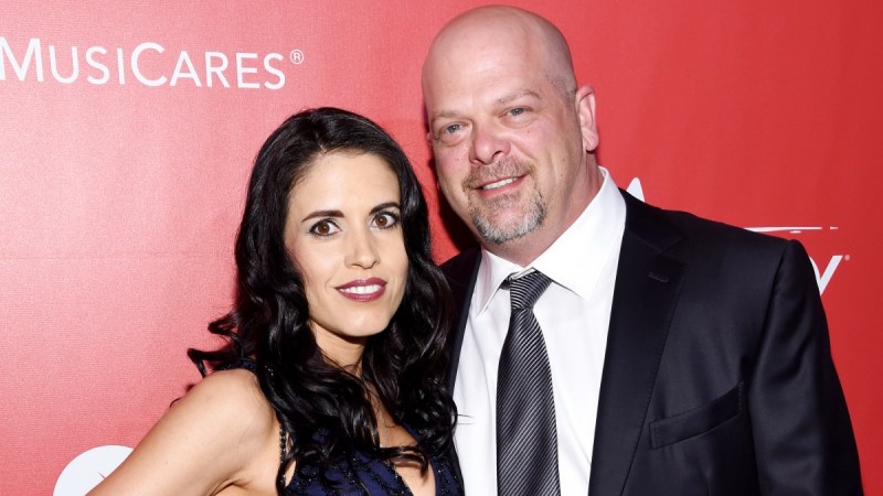 Rick Harrison, in a black suit, poses with now ex-wife Deanna, in a blue gown