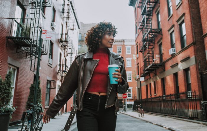 Image of woman walking through NYC.