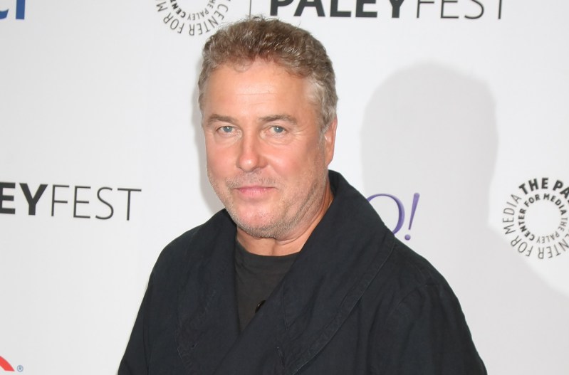 Close up of William Petersen woth a beard in a black shirt
