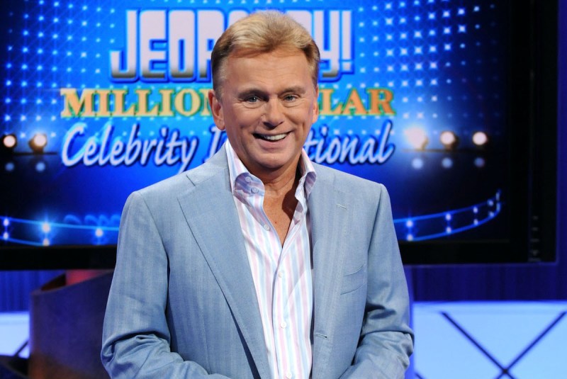 Pat Sajak smiling in a blue coat