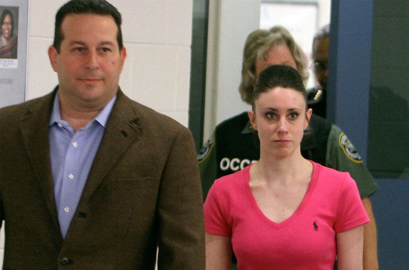 Jose Baez, on the left, walks out of prison with Casey Anthony.