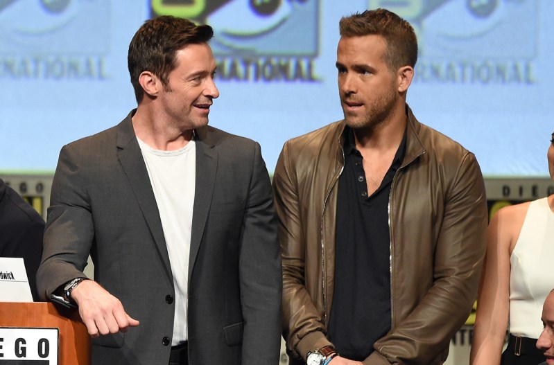 Hugh Jackman on the left, joking with Ryan Reynolds at Comic Con
