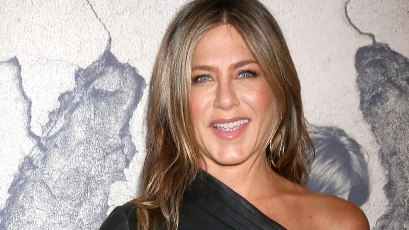 Jennifer Aniston wears a black dress on the red carpet