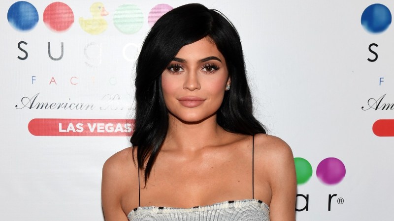 Kylie Jenner wears a gray stripped dress on the red carpet