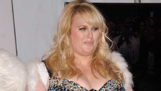 Rebel Wilson wears a black brassiere and white angel wings at the MTV Awards
