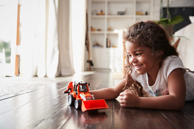 Image of girl playing with fire truck