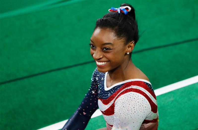 Simone Biles smiling at the Olympics
