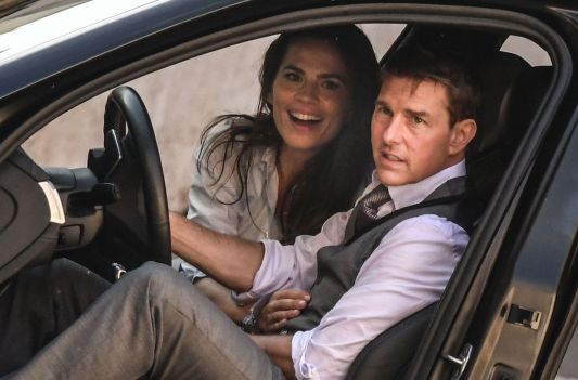 Hayley Atwell smiling in a car with Tom Cruise