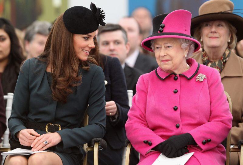 Queen Elizabeth II (R) and Catherine, Duchess of Cambridge (L) watch a fashion show at De Montfort University on March 8, 2012 in Leicester, England.
