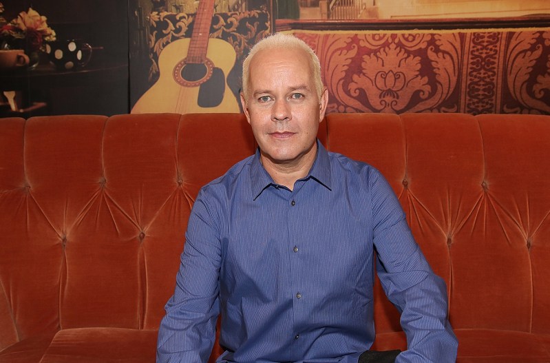 James Michael Taylor sitting on the couch on the set of Friends