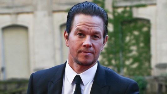 Mark Wahlberg wears a black suit to a movie premiere