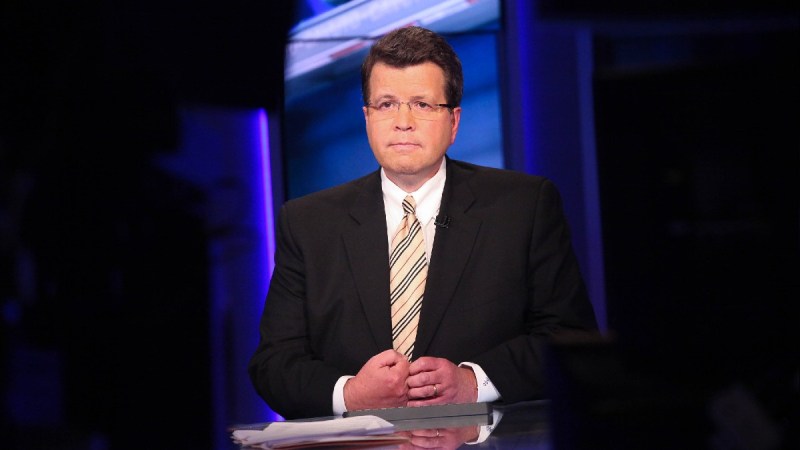 Neil Cavuto wears a dark suit during a TV interview