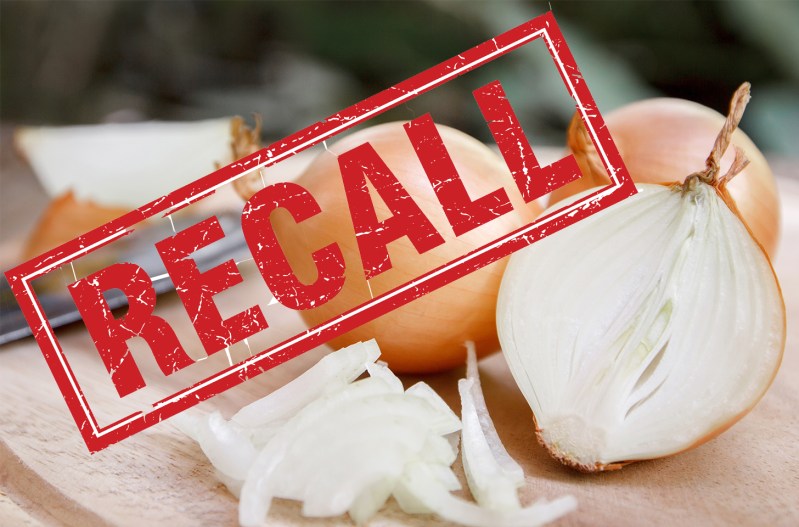 Photo of a cut onion with the word "recall" in red