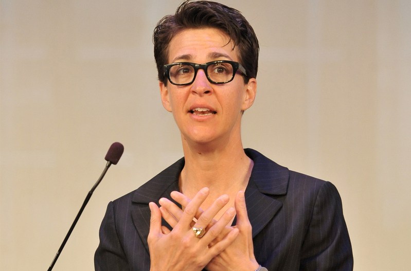 Rachel Maddow speaking into a micrphone