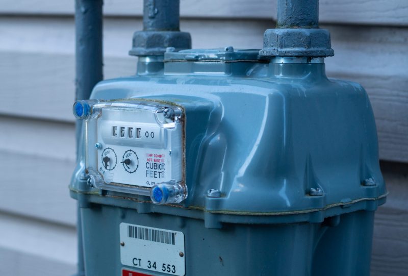 Residential natural gas meter measuring natural gas consumption.