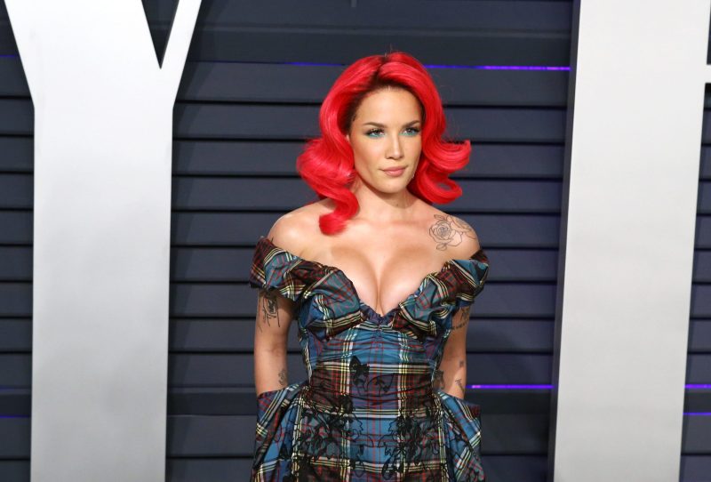 Halsey with bright red hair at a red carpet event in 2019.