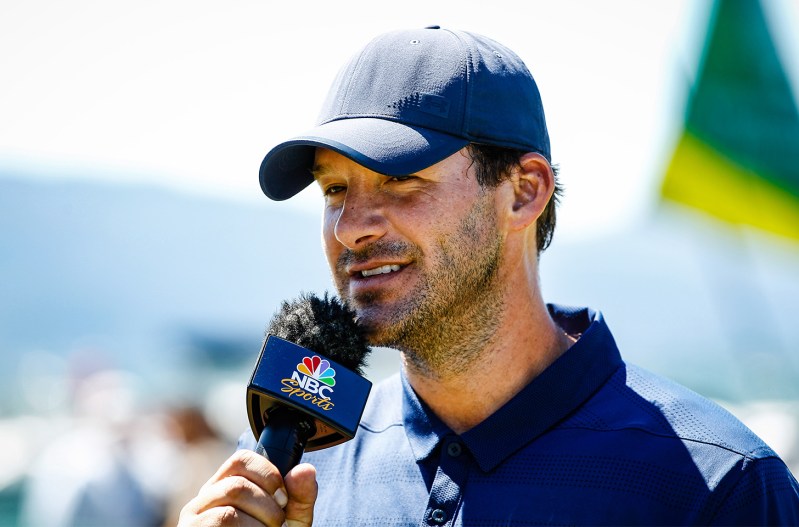 Tony Romo speaking into a microphone