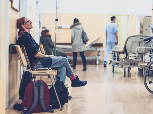 Woman sitting in hospital waiting room