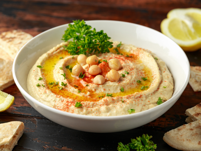 Bowl of Hummus and Chickpeas on table