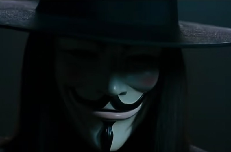Screenshot from V For Vendetta of a man wearing a Guy Fawkes mask