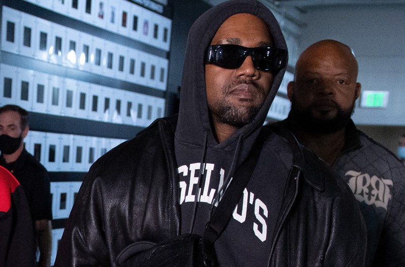 Kanye West in sunglasses and a hoody