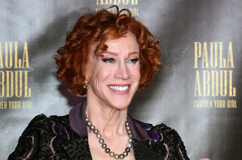 Kathy Griffin smiling in a black dress.