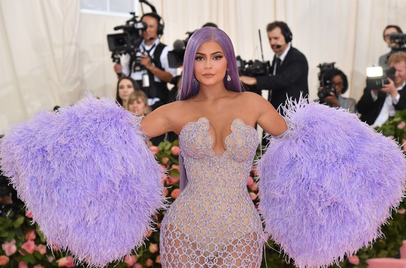 Kylie Jenner in an over the top purple and silver outfit, with purple hair at the Met Gala