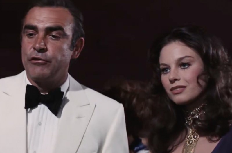 Sean Connery as James Bond sanding next to Lana Wood as Plenty O'Toole in the James Bond film Diamonds Are Forever