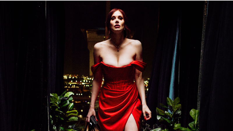 Maitland Ward wears a red dress and strikes a provocative posee