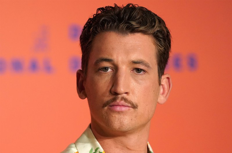 Closeup of Miles Teller with a mustache
