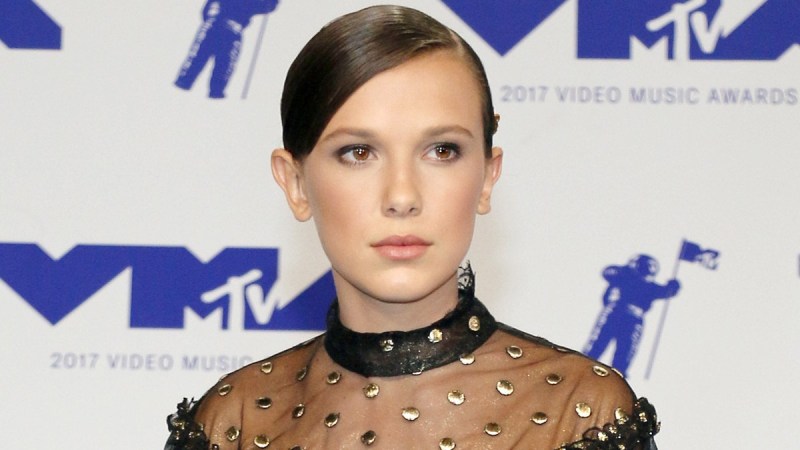 Millie Bobby Brown wears a black dress on the VMA red carpet