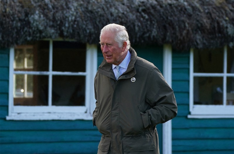 Prince Charles with his hands in his coat pockets