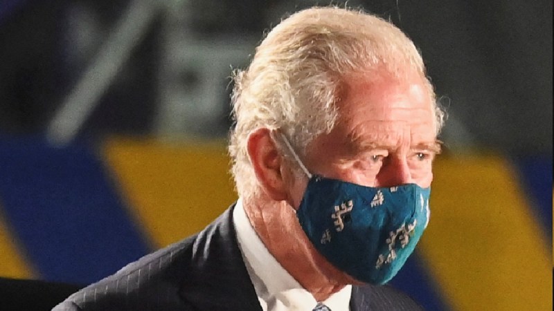 Prince Charles wears a dark suit and teal face mask in Barbados