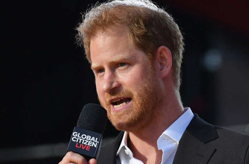 Close up of Prince Harry speaking with a microphone