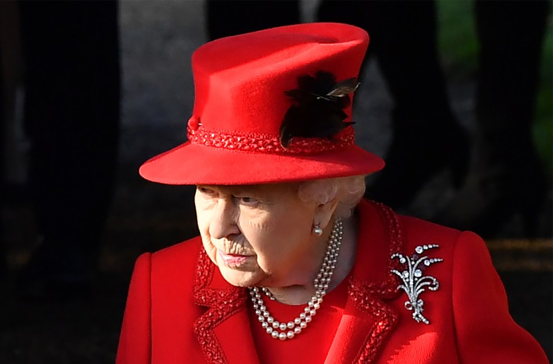 Queen Elizabeth in all red, looking stern