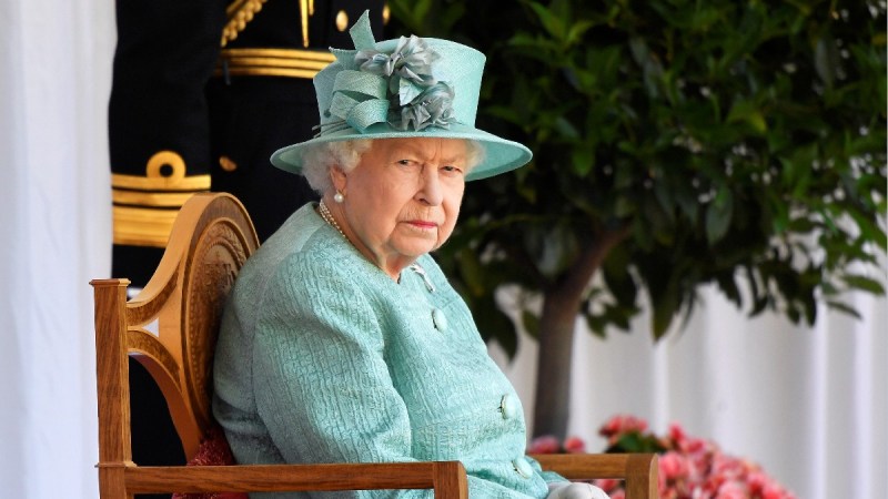Queen Elizabeth wears a robins egg blue dress and matching hat for Trooping the Color