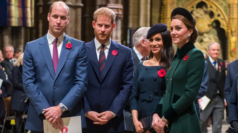 Princes William and Harry stand with wives Kate and Meghan in London