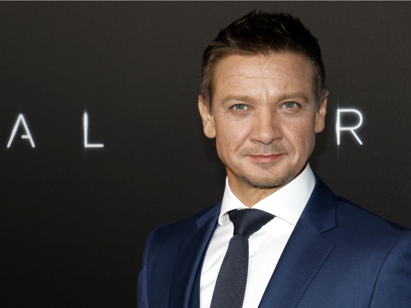 Jeremy Renner on the red carpet wearing a blue suit