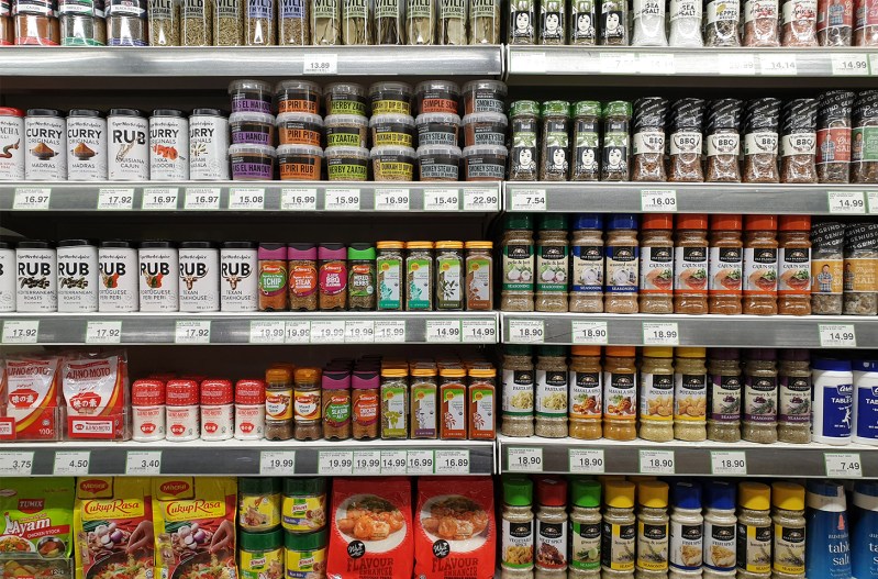 A selection of spices on supermarket shelves