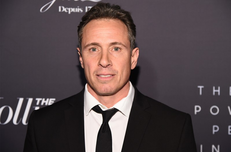 Chris Cuomo wearing a dark suit with his tie slightly loosened