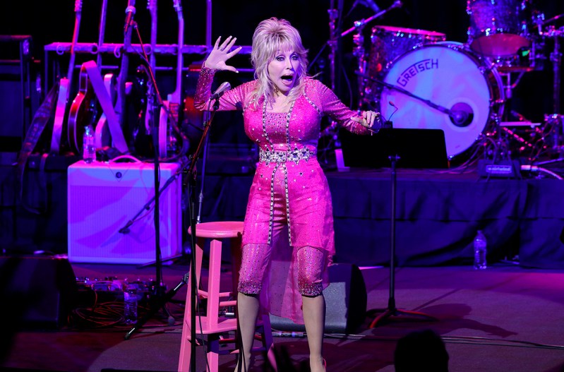 Dolly Parton performing in all pink in 2021