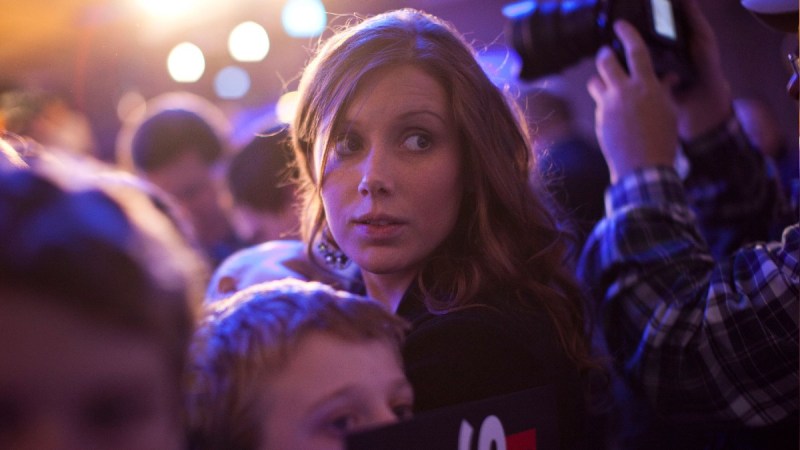 Jana Duggar stands in a crowd during a political event