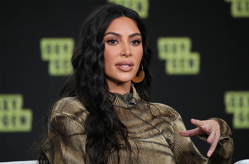 Kim Kardashian looking serious while speaking on stage