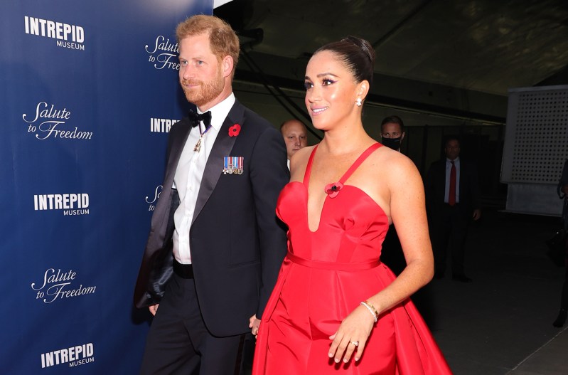 Prince Harry and Meghan Markle in formal wear at a charity event.