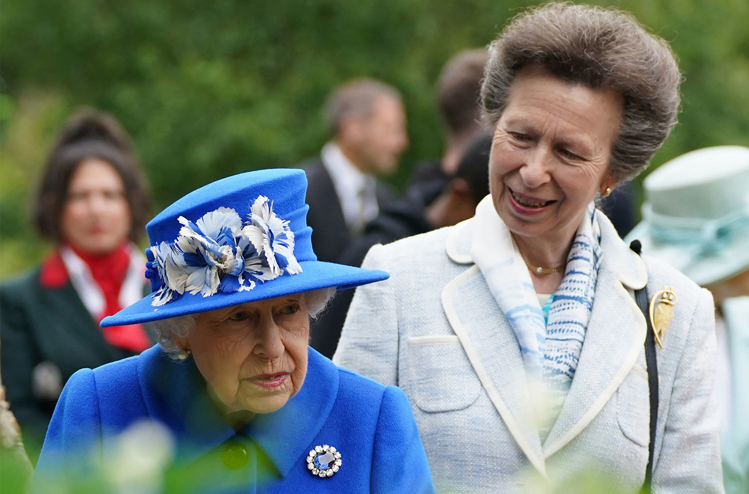 Princess Anne on the right, looking and walking with Queen Elizabeth