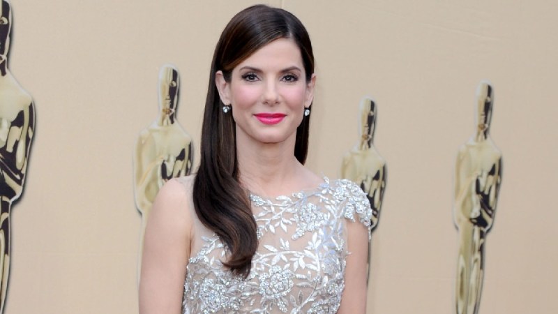 Sandra Bullock wears a silvery dress on the Oscars red carpet