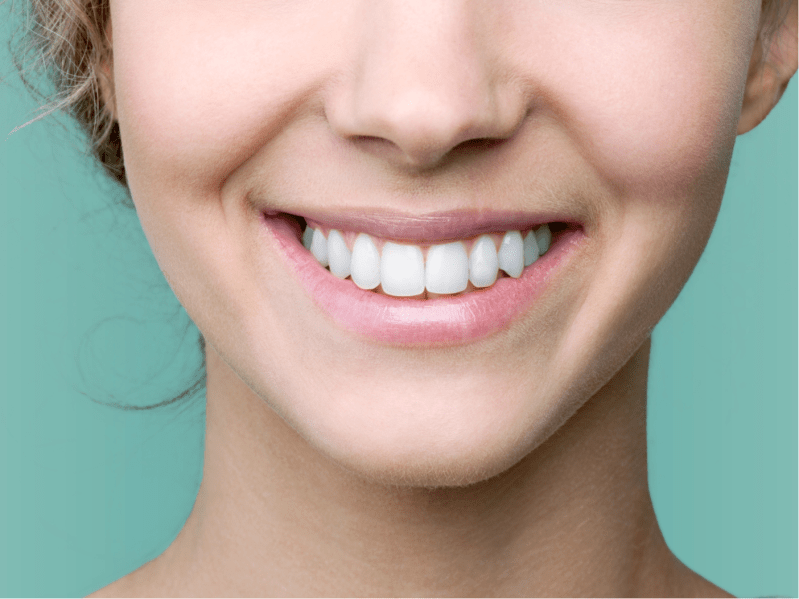 Beautiful smile of young woman with healthy white teeth